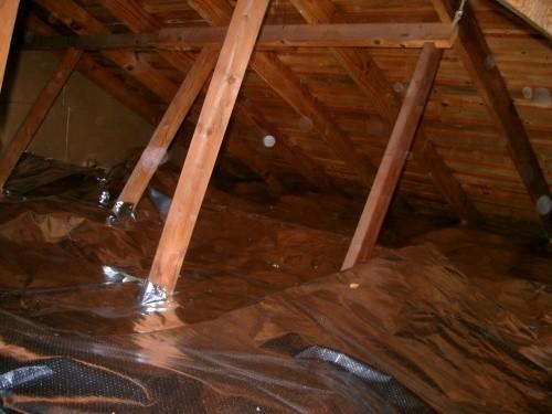 Ra-flect radiant barrier laid over insulation on an attic floor